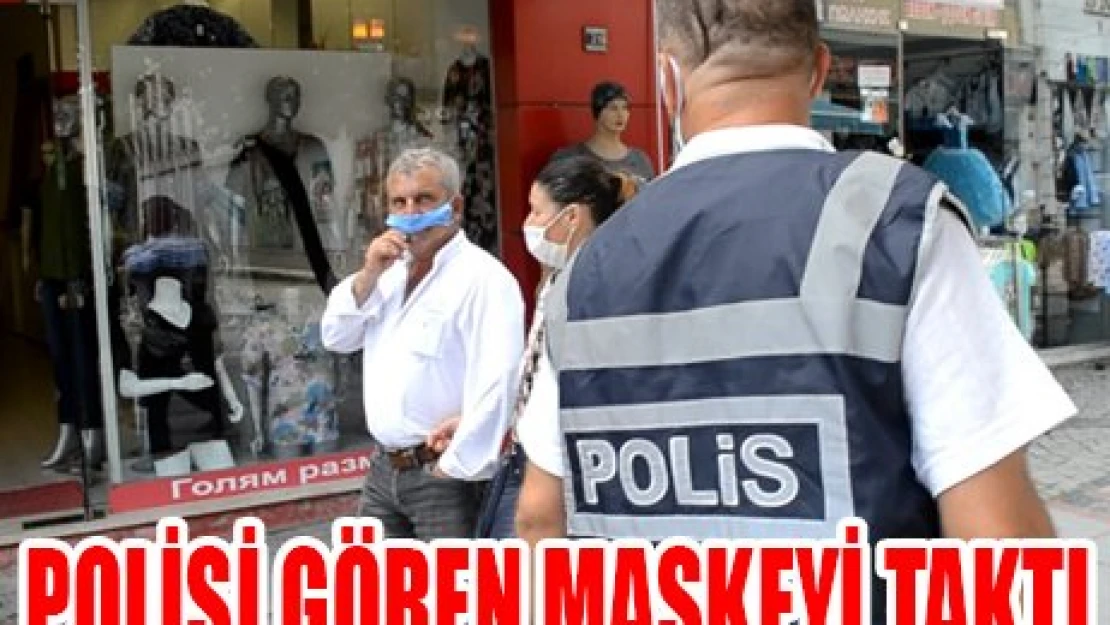 POLİSİ GÖREN MASKEYİ TAKTI